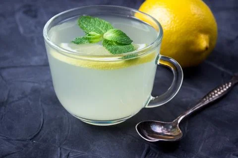 Closeup of Cup of Ginger tea with lemon and mint Stock Photos