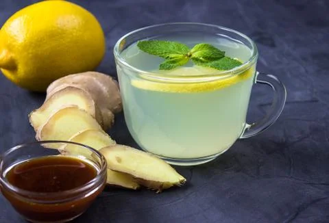 Closeup of Cup of Ginger tea with lemon and mint Stock Photos