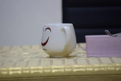 Closeup of a cup with tissue paper on a table Stock Photos