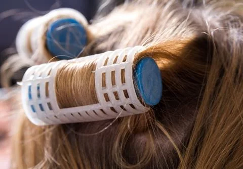 Closeup of the curlers on head Stock Photos