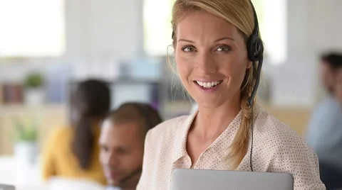 Closeup of customer service manager standing in call center Stock Footage