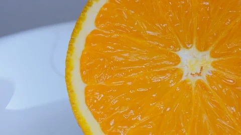 Closeup of cut orange fruit tracking shot Stock Footage 118999866