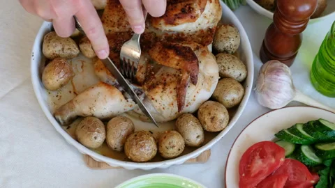 Closeup of a cut piece of fried chicken on a background of the festive table Stock Footage 107980113
