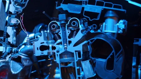 A closeup of a cut section of an internal combustion engine in blue light. Stock Footage 120749542