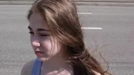 Closeup Of Cute Caucasian Teen Girl On A City Background. Looks Into  Stock Footage