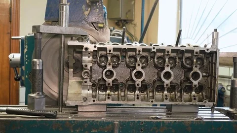 Closeup of cutter processing surface of cylinder head, metal shavings flying Video stock 81537479
