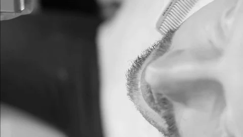 Closeup cutting and grooming beard old-styled footage. Stock Footage 77949955