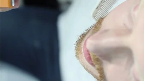 Closeup cutting and grooming beard old-styled footage Stock Footage 77949988