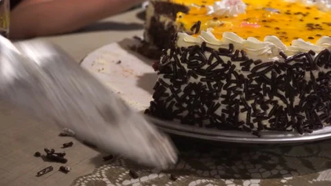 Closeup cutting and serving a passion fruit cake with a knife Stock Footage 154817463