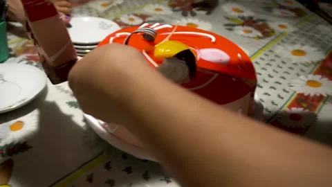 Closeup cutting and serving a red jelly birthday cake with a knife Stock Footage 147454457