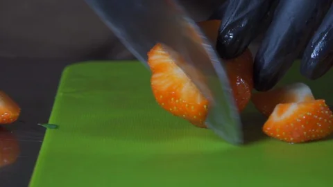 Closeup of cutting fruit for fruit salad Stock Footage 127855222
