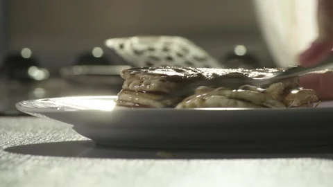 Closeup cutting into stack of pancakes with fork Stock Footage 282232098
