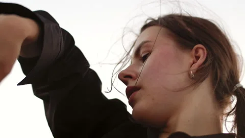Closeup of a dancer's face making smooth movements with her hands, modern dance Stock Footage 200527771