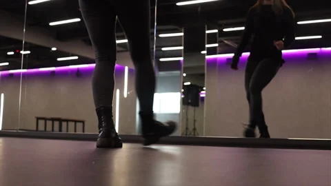 Closeup dancers legs practicing movement indoors near the mirror Stock Footage 213617828
