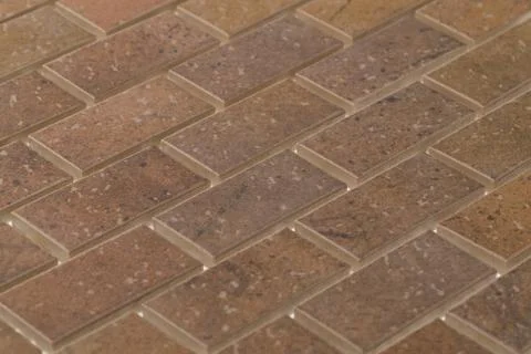 Closeup of dark brown rectangle tiles under the lights - great for background Stock Photos