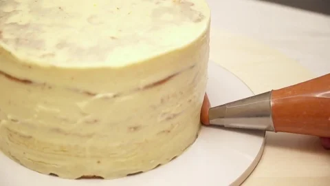 Closeup of decarating a cake with a cream Stock Footage 74586841