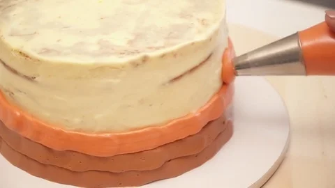 Closeup of decarating a tasty cake with a cream Stock Footage 74587090