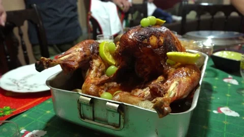 Closeup decorating a turkey on the table for christmas dinner with green grapes Video stock 171946176