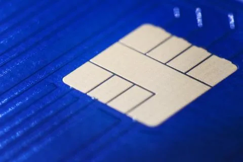 Closeup defocused view of blue plastic credit card EMV micro chip. Selective  스톡 사진