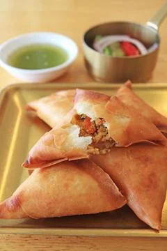 Closeup of Delectable Samosa, a Deep Fried Triangular Pastry Served with Chutney Stock Photos