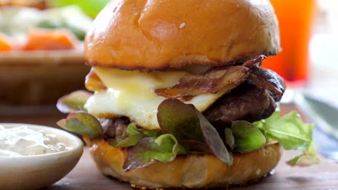 Closeup of a delicious beef burger served at an outdoor restaurant Stock-Footage 239287220