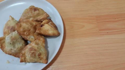Closeup of delicious home made samosa or pastries food on white background Stock Photos