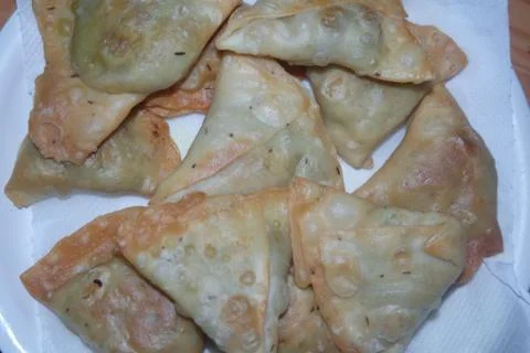 Closeup of delicious home made samosa or pastries food on white background 스톡 사진