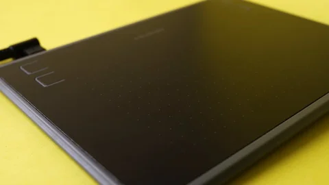 Closeup of the designer draws on the graphic tablet on the computer Stock Footage 129443434
