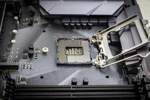 Closeup detail of CPU socket of a modern computer black motherboard. Stock Photos