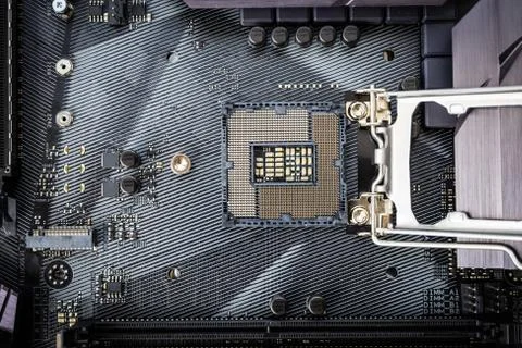 Closeup detail of CPU socket of a modern computer black motherboard. Stock Photos