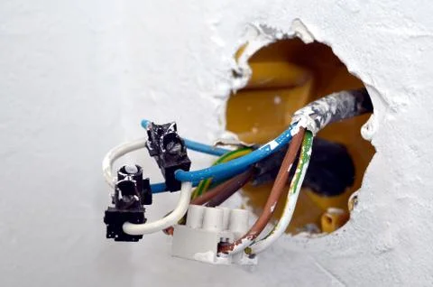 Closeup detail of electrical cable from the socket boxes Stock Photos