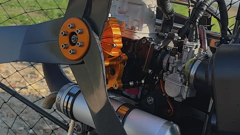 Closeup detail of engine and propeller of paramotor paraglider frame Stock Footage 262306086