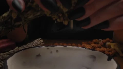 Closeup, detailed. hands of a witch with black nails above a bowl of thick smoke Stock Footage 142872925