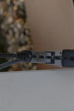 CloseUp of a Detailed Network Cable Connector As Seen in Use Stock Photos