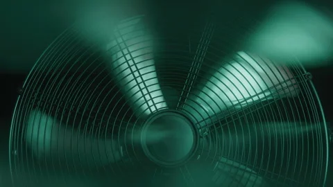 Closeup Details of a Fan in a Dark Studio with Green Neon Lighting Stock Footage 270318256
