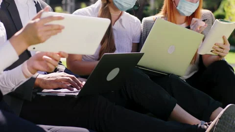 Closeup details studying group of students in the pandemic using laptops and Stock Footage 194415374