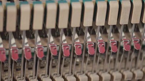 Closeup details of upright piano strings hammer, Tracking shot Stock Footage 297055563