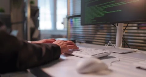 Closeup of developer hands typing code on keyboard at office workstation Stock Footage 328353671