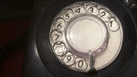 Closeup on dialing Using A vintage  Rotary Phone Stock Footage 88386579