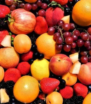 Closeup of different kinds of fruit outdoors on a sunny day Stock Photos