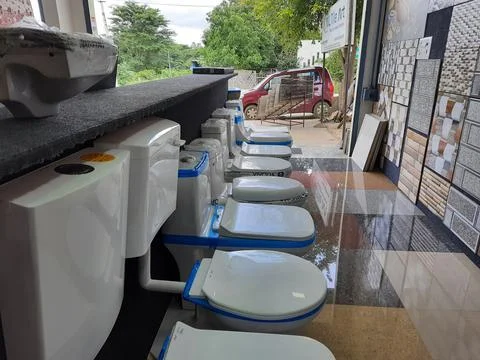 Closeup of different types of building tiles and sanitary display in the stor Fotos de archivo