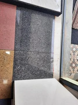 Closeup of different types of building tiles and sanitary display in the stor Stock Photos
