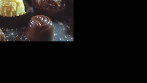 Closeup of different types of delicious chocolate candies montage Stock Footage 81153416
