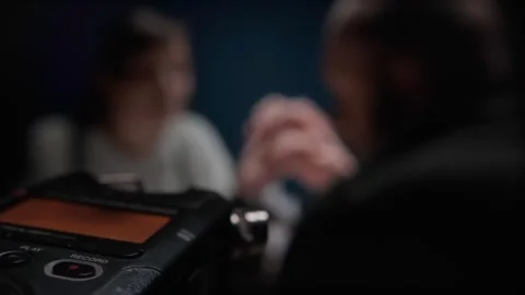 Closeup of digital audio voice recorder, blinking record button. Interrogation Stockbeeldmateriaal 254059877