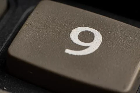 Closeup of a digital keypad showcasing the number nine in a modern financial Stock Photos