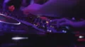 Closeup of disk jockey switching buttons on deck, people dancing HD Footage