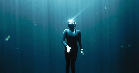 Closeup of a Diver going up with the sun rays Stock Footage 270112610