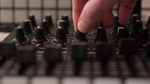 Closeup DJ Audio Mixer Adjusting Knobs and Sliders on the Console Stock Footage 171585257