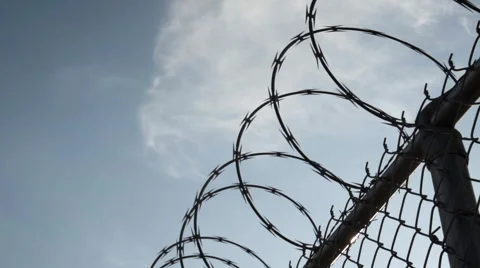 Closeup dolly shot of a barbed wire fence - Brooklyn, NYC Video stock 68040375