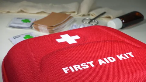 Closeup dolly shot of a first aid kit box on a table top. Stock Footage 130393987
